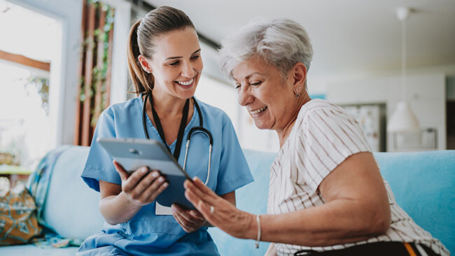Home care healthcare professional using digital tablet