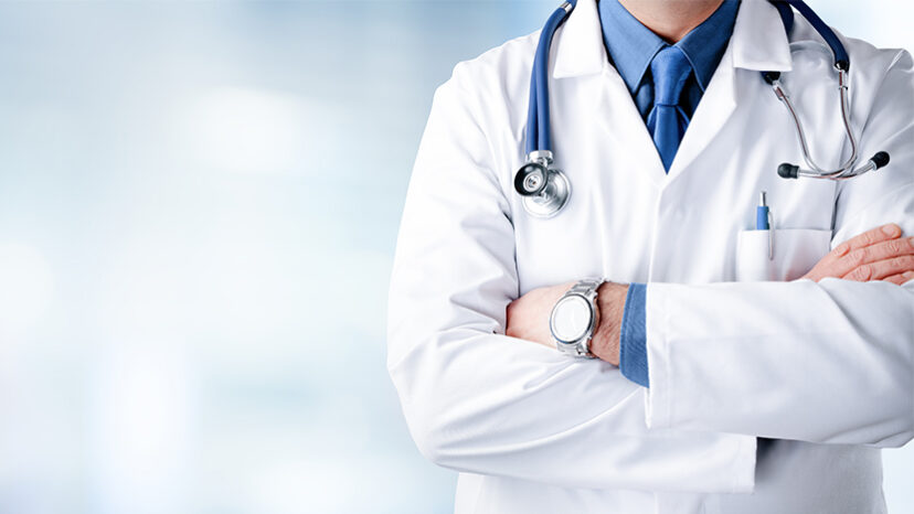 Doctor Man With Stethoscope In Hospital